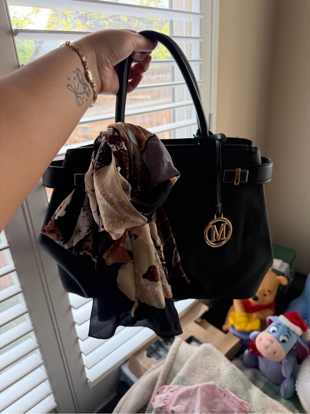 Black Structured Shoulder Bag with Gold Pendant and Printed Scarf